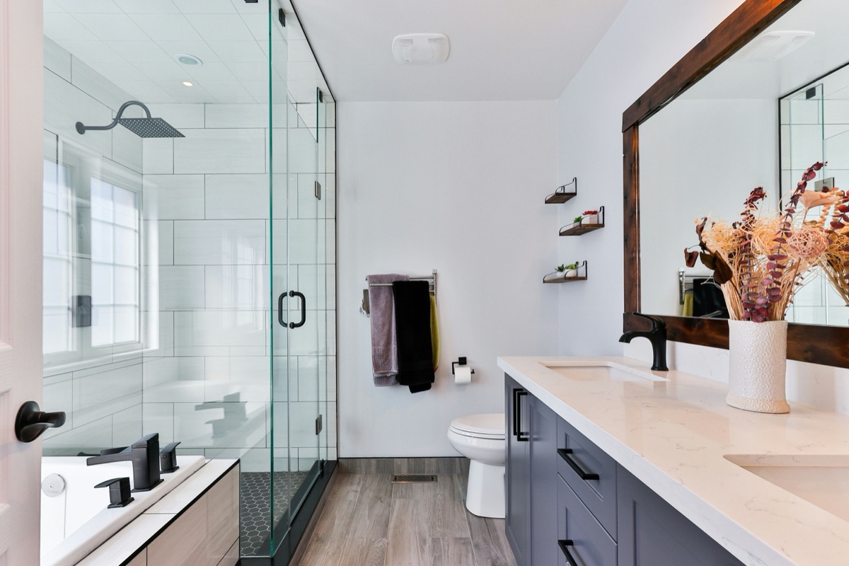 Modern remodeled bathroom with glass shower and vanity