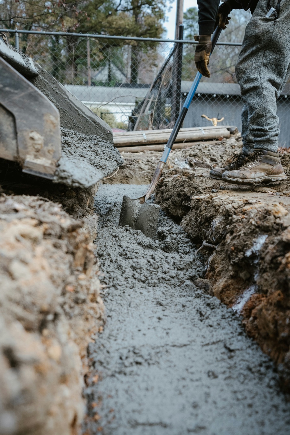 Wet concrete being finished for a new slab